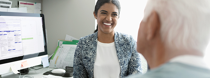 Health care provider smiling at a patient