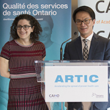 Man and woman speaking at the launch of an ARTIC initiative