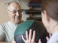 Patient is doing exercises with his health care professional